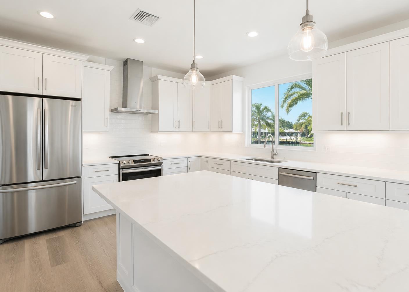 Spotless white kitchen with clear quartz countertops in a Florida home